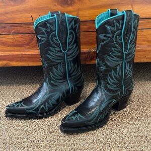Never worn Sendra boots. The color is black with turquoise stitching sized 6.